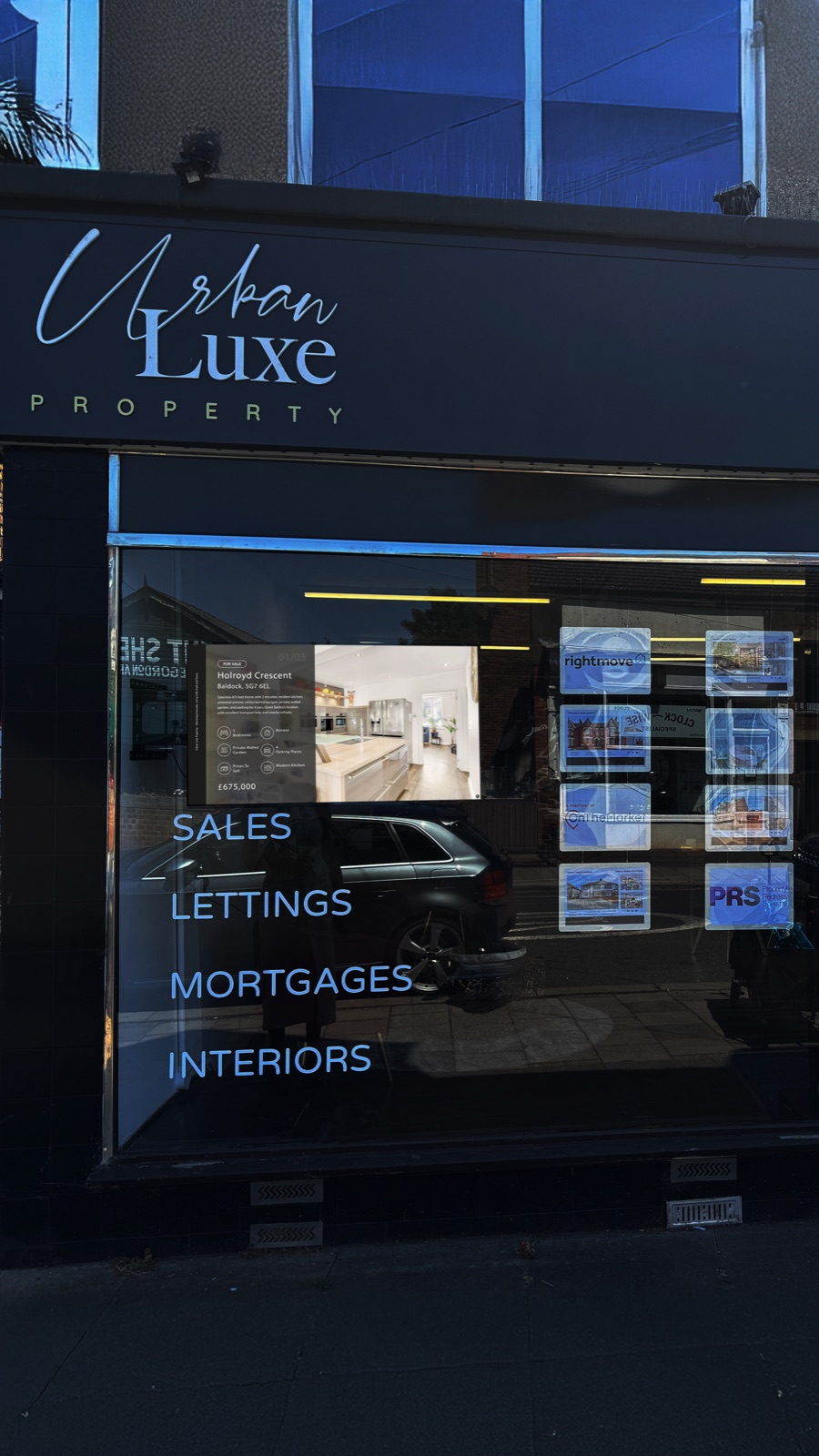 Urban Luxe digital display shown in a shop window